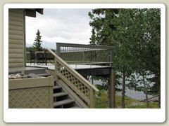 The family home with a small lake behind