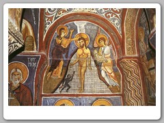 Frescoes on the walls of a large church carved in the soft stone